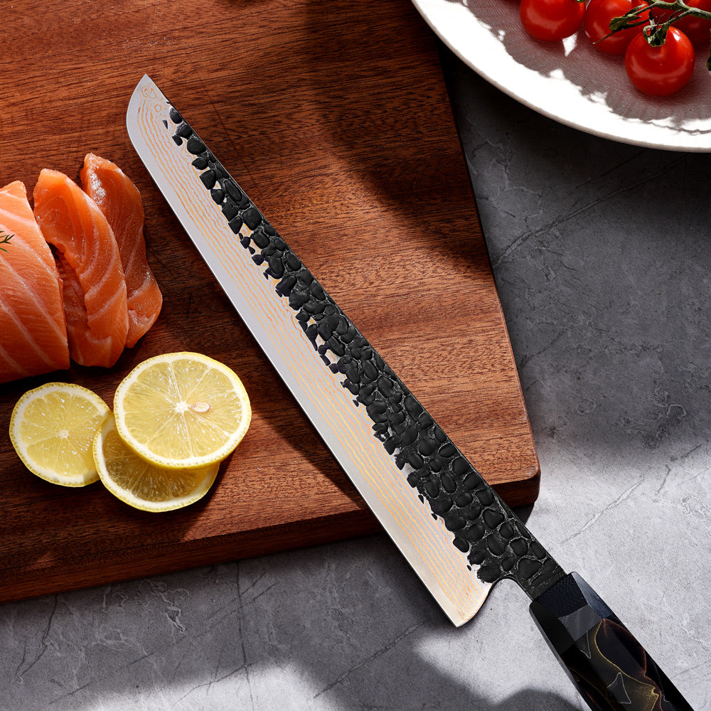 Decorative slicer-slaugther knife with a resin handle on a cutting board with salmon and lemon slices.