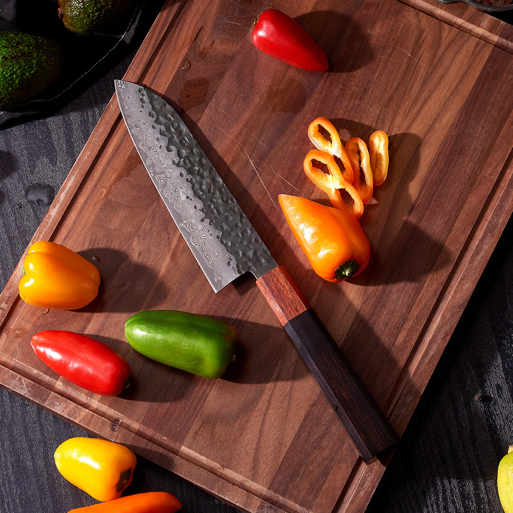 sharp Japanese Knife cutting pepper on wooden board